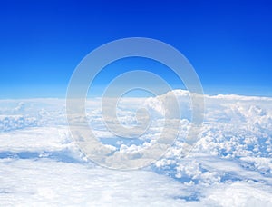 White cumulus clouds clear blue sky background, aerial cloudscape panoramic above view, high azure skies panorama, fluffy cloud