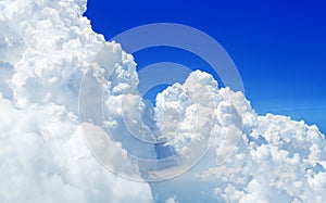 White cumulus clouds on clear blue sky background close up, beautiful aerial cloudscape view, azure skies backdrop, fluffy cloud