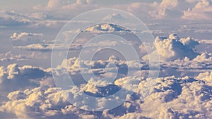 White cumulus clouds on clear blue sky background closeup