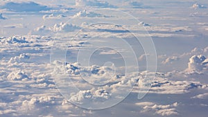 White cumulus clouds on clear blue sky background closeup