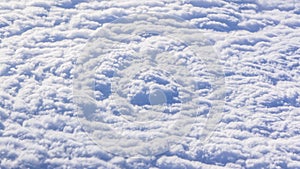 White cumulus clouds on clear blue sky background closeup