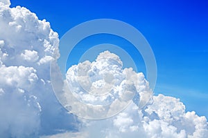 White cumulus clouds on clear blue sky wide panorama, beautiful aerial cloudscape panoramic view, azure skies backdrop