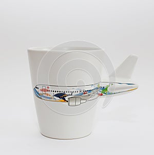 White cup with aircraft image