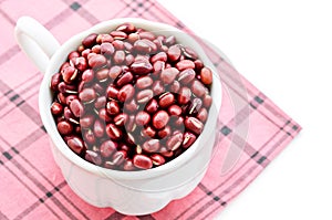 The white cup with Azuki beans or red beans.