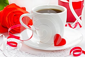 White cup of black coffee with little red heart. Valentine Day C