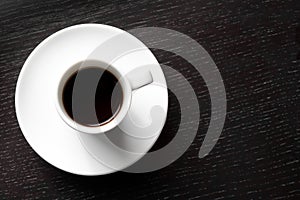 White cup with black coffee with space for text