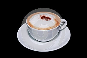 White cup of cappuccino coffee in black background