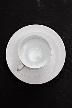 White cup on ceramic background