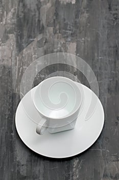 White cup on ceramic background