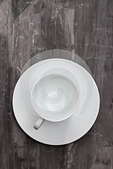 White cup on ceramic background