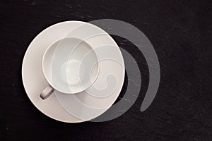 White cup on ceramic background