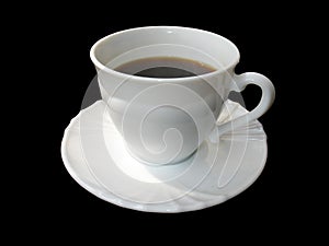 White cup of coffee on saucer isolated on black