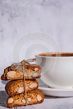 White cup of coffee and traditional homemade italian cantuccini cookies. Biscotti Cantuccini Cookie Biscuits with