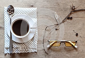 White cup of coffee on a wooden table