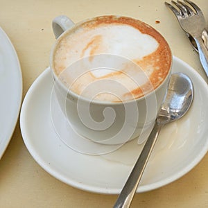 White cup of fresh cappuccino