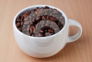 A White Cup Full Of Coffee Bean