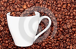 A white cup full of coffee beans