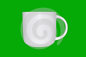 White cup on green background