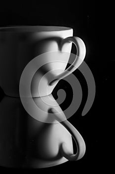 White cup with heart shadow