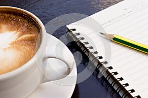 White cup of hot coffee latte