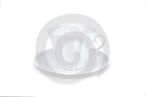 White cup and saucer for coffee or tea. Isolated on white background. Close-up.