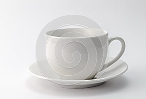 White cup and saucer isolated on white background