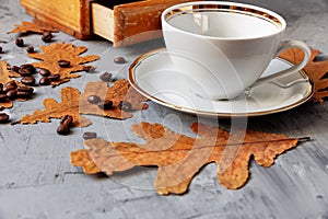 White cup with a saucer on the table