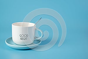 White Cup on saucer with teaspoon