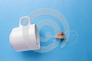 White cup and ship model