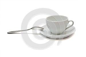 White cup with spoon and saucer