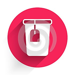 White Cup with tea bag icon isolated with long shadow background. Red circle button. Vector
