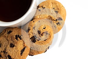 White cup of tea with cookies with chocolate chips