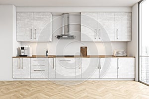 White cupboards in modern white kitchen