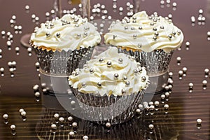 White Cupcakes with Silver Decorative Sprinkles