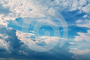 White curly clouds in a blue sky. Sky background,