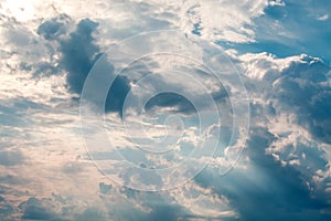 White curly clouds in a blue sky. Sky background,