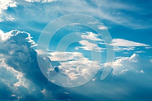 White curly clouds in a blue sky. Sky background,