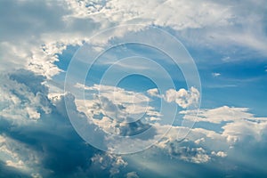 White curly clouds in a blue sky. Sky background,