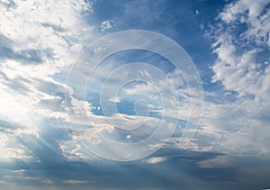 White curly clouds in a blue sky. Sky background,