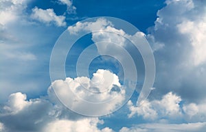 White curly clouds in a blue sky. Sky background.