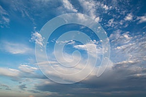 White curly clouds in a blue sky. Sky background,