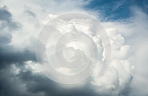 White curly clouds in a blue sky. Sky background