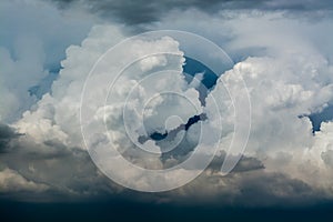 White curly clouds in a blue sky. Sky background,