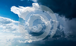 White curly clouds in a blue sky. Sky background,