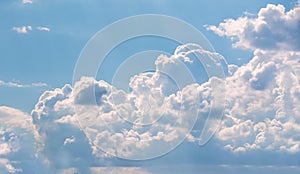 White curly clouds in a blue sky. Sky background,