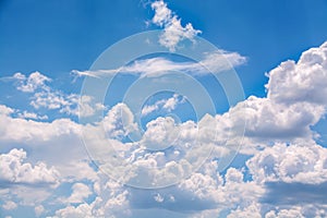 White curly clouds in a blue sky. Sky background,