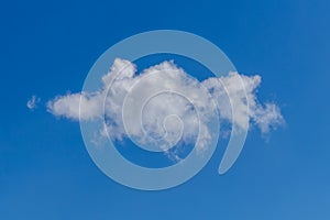 White curly lonely cloud in the blue sky