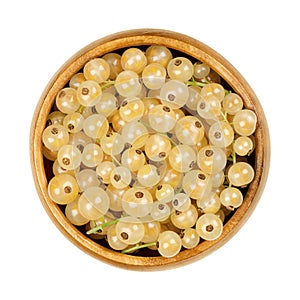 White currant berries, whitecurrant berries, in a wooden bowl