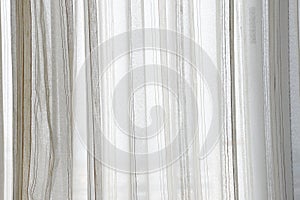 White curtain wavy with a pattern background. transparent curtain on window