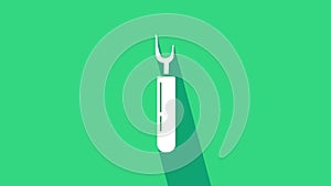 White Cutter tool icon isolated on green background. Sewing knife with blade. 4K Video motion graphic animation